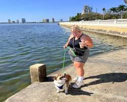 Samantha has adopted a cute dog in her home with whom she loves to have a walk.